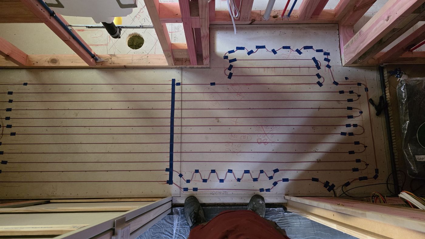 Electric underfloor heating by Floorheat NZ — the heating cable run over a prepared timber subfloor, the same system we fit across North Shore