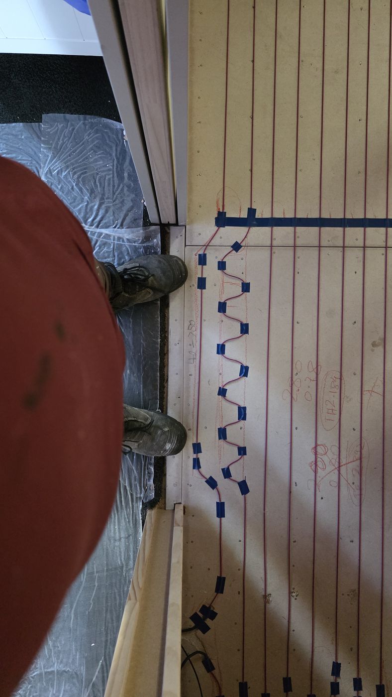 Electric underfloor heating by Floorheat NZ — the heating cable run over a prepared timber subfloor, the same system we fit across North Shore