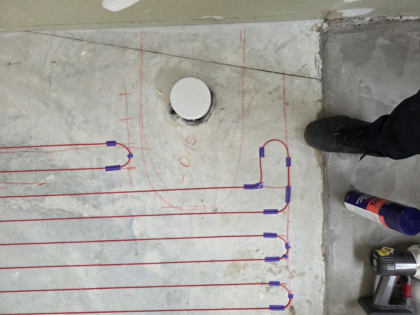Electric underfloor heating by Floorheat NZ — the heating cable laid out across a bathroom floor before the screed goes on, the same system we fit across West Auckland