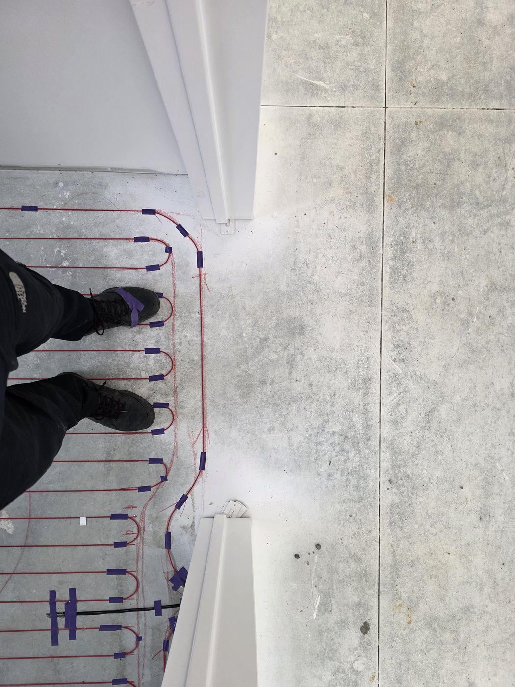 Electric underfloor heating by Floorheat NZ — the heating cable connections taped down and ready for the electrician, the same system we fit across East Auckland